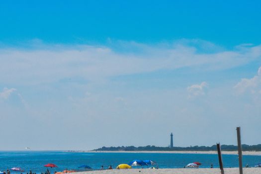 Looking Over the Blue Sea on a Beach in New Jersey at a Lighthouse