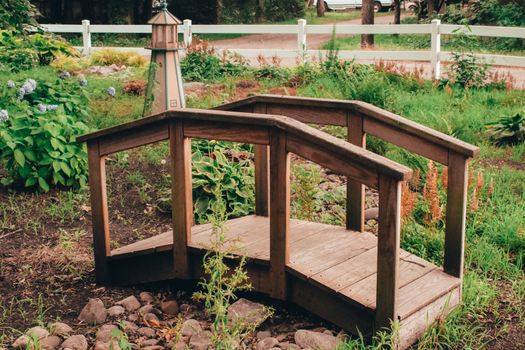 A Small Decorative Wooden Bridge in a Garden