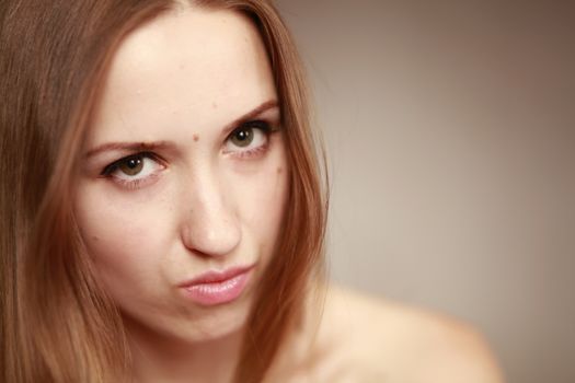 Emotional girl portrait on the brown background