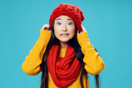 Woman with red scarf and hat emotions elegant style winter coolness charm lifestyle blue background