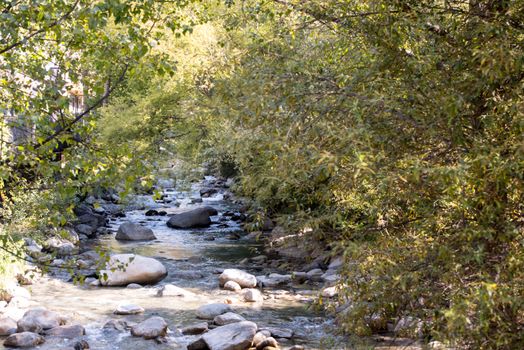 Sunny day in the VAlira River in the city of Encamp in Andorra in summer 2020.