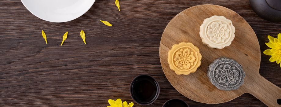 Colorful beautiful moon cake, mung bean cake, Champion Scholar Pastry cake for Mid-Autumn festival traditional gourmet dessert snack, top view, flat lay.
