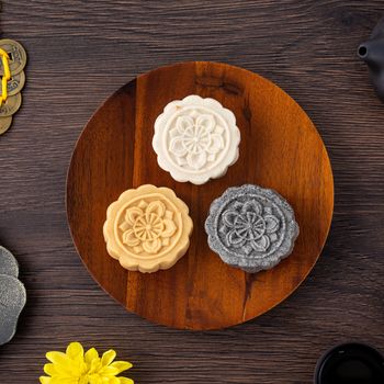 Colorful beautiful moon cake, mung bean cake, Champion Scholar Pastry cake for Mid-Autumn festival traditional gourmet dessert snack, top view, flat lay.
