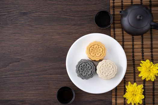 Colorful beautiful moon cake, mung bean cake, Champion Scholar Pastry cake for Mid-Autumn festival traditional gourmet dessert snack, top view, flat lay.