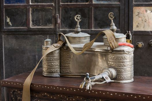 Beautiful unusual old silver urn with intricate design and carry strapsfor carrying and selling tea in the streets of Damascus, Syria. High quality photo