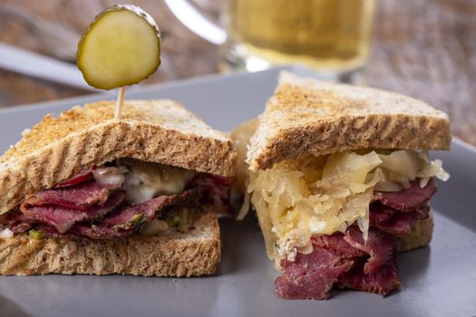 reuben sandwich on a plate with fries