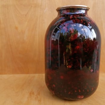 A jar of a black currant compote freshly made recently