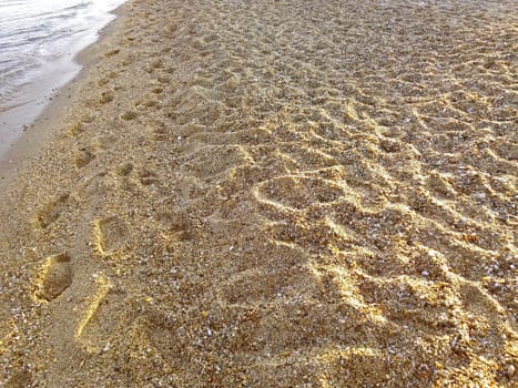 Footprint on the beach, sandy beach in Greece