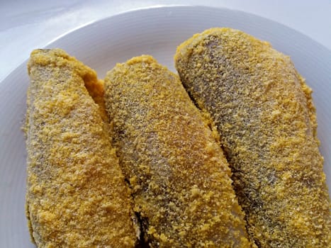 Fish sprinkled with flour, redy for fry. Close up.