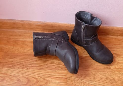 Winter leather shoes for little girls. Black color.