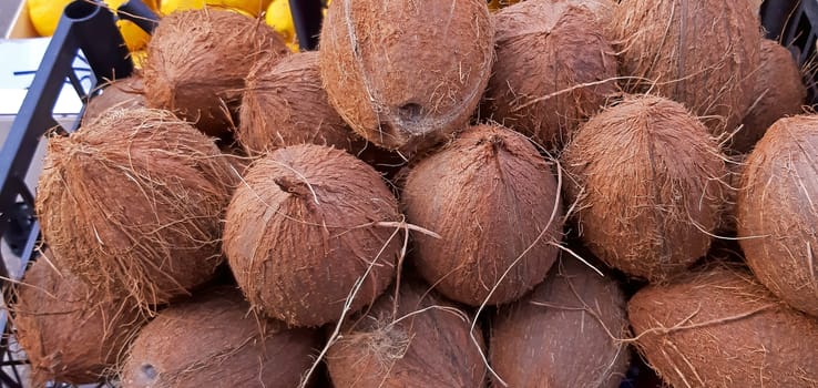 Some brown coconuts on sale textured
