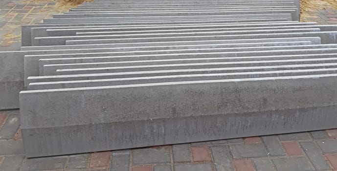Concrete fence caps used in construction. Construction materials.