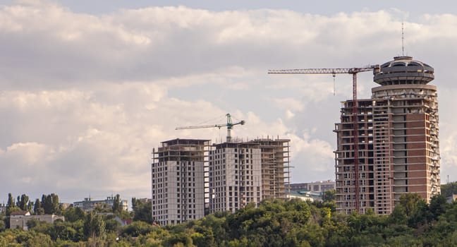 Several buildings under construction. Future apartments Copy Space.