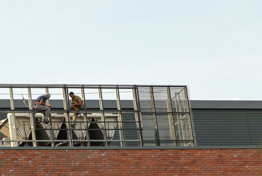 Chisinau, Moldova - July 14 2019. People are working on the roof