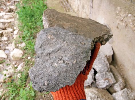 stone worker at construction, the worker brings the stone