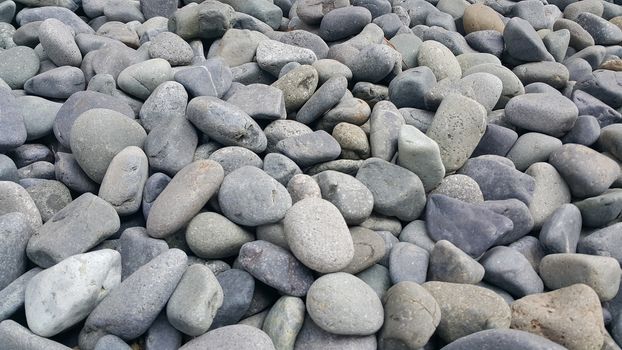 Texture background: Rock Pebbles, small, rounded, smooth pibbles with copy space for text