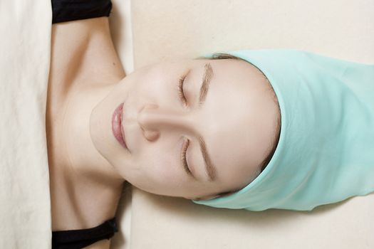 Close up shot of young woman at beautician table