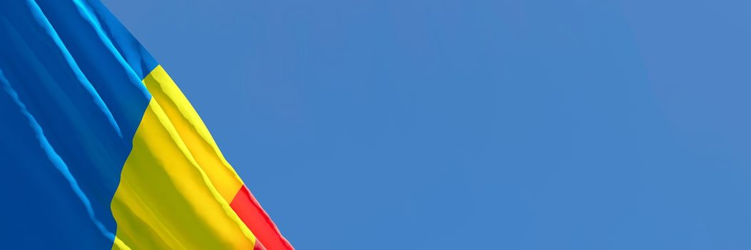 3D rendering of the national flag of Romania waving in the wind against a blue sky