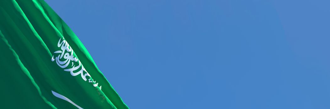 3D rendering of the national flag of Saudi Arabia waving in the wind against a blue sky