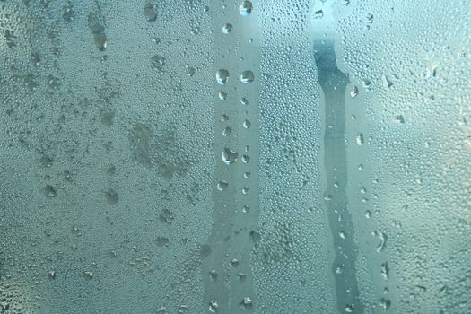 Bright grey color glassy texture, with water drops on it: abstract background
