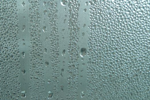 Bright grey color glassy texture, with water drops on it. Water drop glassy background
