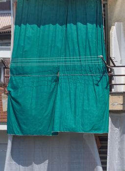 sun blocking curtains made of heavy green fabric