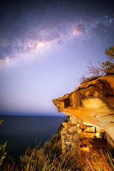 Starry skies over the Eastern escarpment near Sydney. Pollution and city light dampen the intensity of the stars but they are still shining above, captured with milky way stretching across the sky
