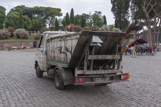 Rome, Italy - June 27, 2010: One of the ramshackle, dirty and defaced trucks and vans of Rome's public garbage collection service.