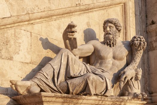 Rome, Italy - June 27, 2010: The statue of the river god of the Nile on Capitoline Hill, Piazza Campidoglio, next to the Fountain of the Dea Roma.