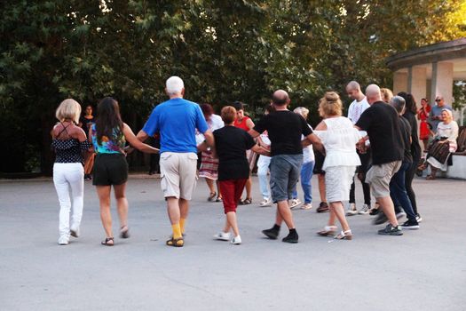 Varna, Bulgaria - September, 06, 2020: people dancing national Bulgarian dance