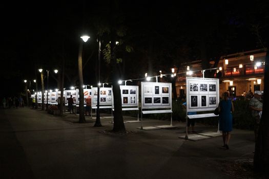 Varna, Bulgaria - September, 06, 2020: open-air photo exhibition in the park in the evening