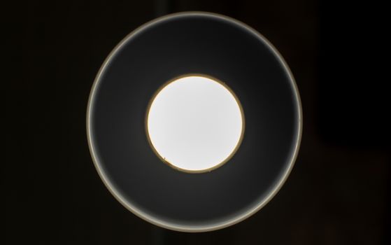 White glowing circles on a black background. There is a place to insert text, a texture. Simple way