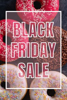 Black Friday sale banner on sweet donuts background