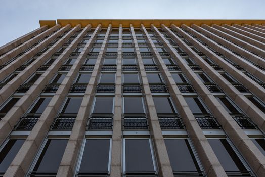 Detail of a mid-19th century skyscraper with large windows, contemporary European architecture