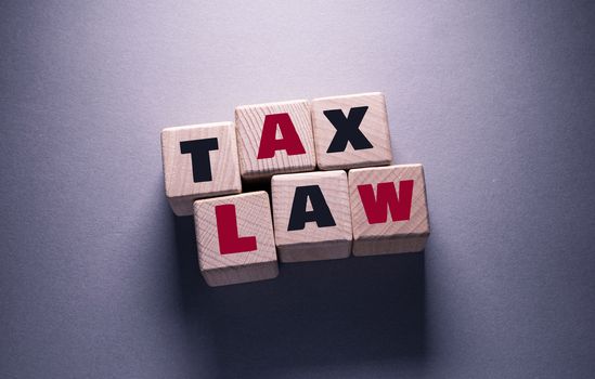 Tax Law Word Written on Wooden Cubes