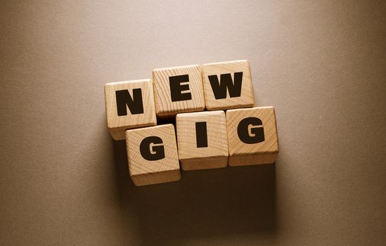 New Gig Word Written on Wooden Cubes