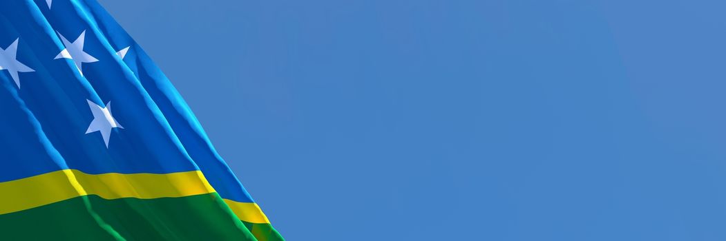 3D rendering of the national flag of Solomon Islands waving in the wind against a blue sky