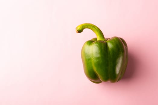Close up above top view of raw green bell peppers on pink pastel background, fresh organic vegetables, Healthy lifestyle diet food concept