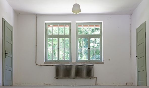 Old radiator in an empty historic home, heater