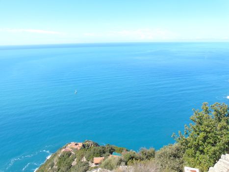 Liguria, Italy - 09/01/2020: Steep stairway overlooking the sea leading to the town of Monesteroli, in Liguria.