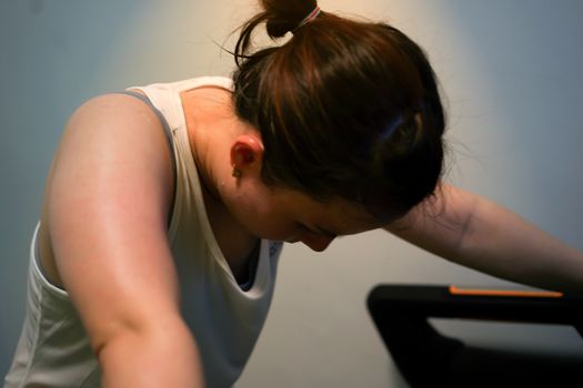 tired woman jogger on treadmill