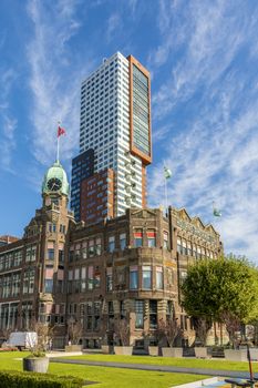 Rotterdam, Wilhelminapier, Netherlands, September 2019: View on the famous Hotel New York with Montevideo tower rising up in the background.