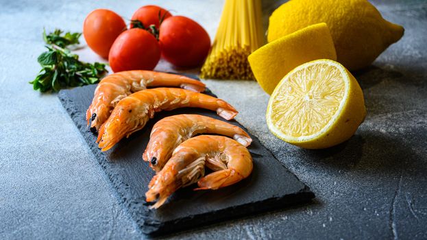 ingredients for pasta with shrimps and fresh ingredients. side shot