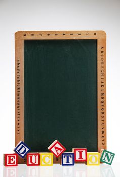 close up of the alphabet blocks in front of the black board