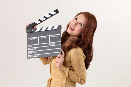 Girl with Movie Slate on the white background