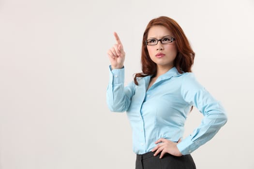 Businesswoman using large transparent touch screen