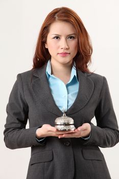 woman holding a desk bell