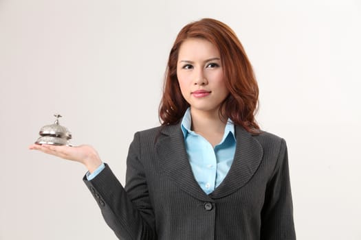 woman holding a desk bell