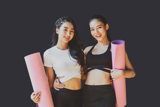 Portrait Couple sporty asian woman standing and smiling, wearing sportswear bra and pants fashion, posture position, sport club community, sports and healthcare concept