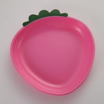 pink strawberry shaped plate on the white background